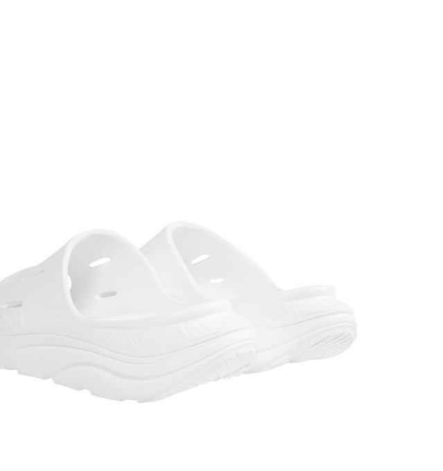 Image 3 of 4 - WHITE - HOKA Ora Recovery Slide 3 featuring perforated rubber upper with EVA sole, slip-on styling and molded footbed.