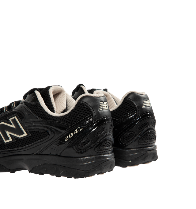 Image 3 of 5 - BLACK - NEW BALANCE 204L Sneaker featuring multi-piece upper with embossed overlay, screen-printed graphics along the saddle, distinctive outsole with 2000s-inspired strike path and 70s-influenced tread pattern, double-stacked synthetic leather and reflective 'N' logo, patent leather and mesh upper and EVA outsole.