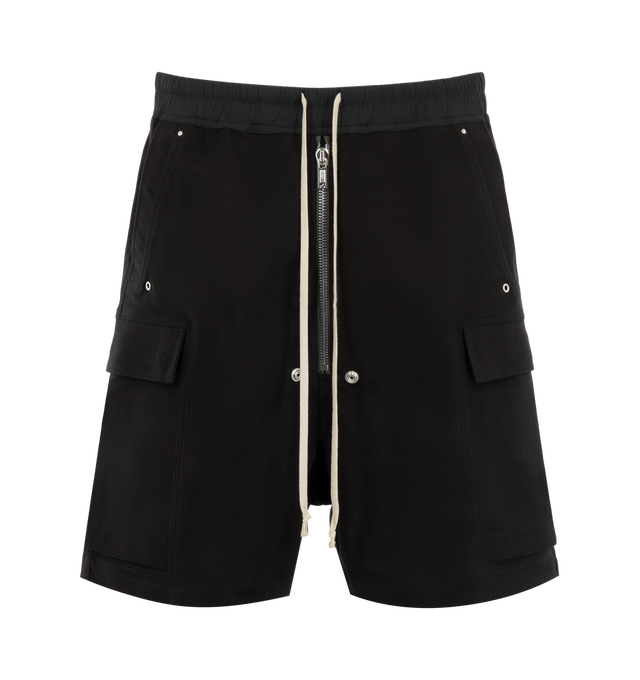 Image 1 of 3 - BLACK - Rick Owens Mens Cargobela Shorts are crafted from overdyed waxed cotton denim. Feature a knee-length wide-leg silhouette, dropped crotch, elasticized waistband with drawstring, exposed Bela front zip closure with dual snap buttons, concealed snap cargo pockets, rear welt pockets, and topstitch detailing. Main Material: 100% Cotton; Waistband: 97% Cotton, 3% Elastane. Made in Italy.