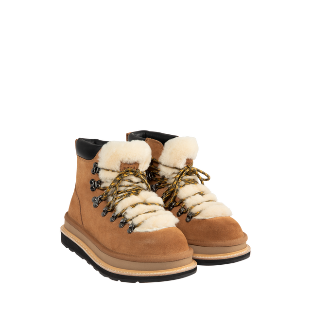 Image 2 of 4 - BROWN - UGG x sacai hiker boots designed for everyday wear, combines UGG's iconic premium  suede with sacai's unmistakable hybridized aesthetic. Upper is made with suede sourced from certified farms that practice regenerative agriculture upper. Midsole incorporates sugarcane EVA. Features Vibram XS Trek Evo. Unisex style in women's sizes.