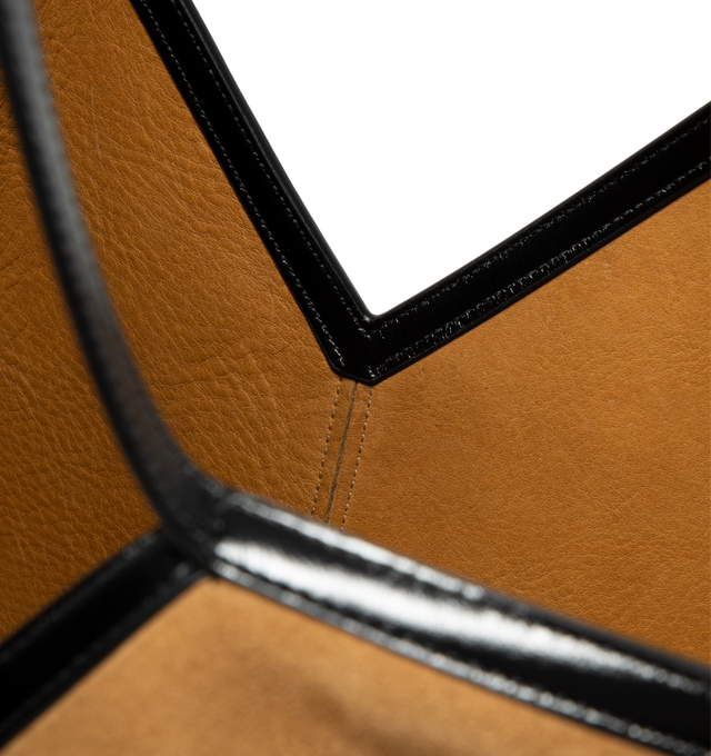 Image 3 of 3 - BROWN - Saint Laurent Womens Slim Tote Bag is crafted from velour grained leather. Features a spacious silhouette, suede lining, subtle Y-stitched signature, hook closure, interior zip pocket, and top handles. Main Material: Suede Leather; Lining: Suede. Made in Italy.