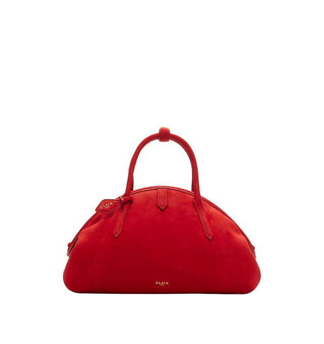 Image 1 of 1 - RED - The Azzedine Alaia Small top-handle purse is crafted from vibrant red suede into a curved silhouette with tubular handles and a detachable charm. Material: leather suede, lining: leather. Height 19cm-7.5"; Max. width 35cm-14"; Depth 11cm-4.5"; Length of handles 33cm-13". Made in Italy.