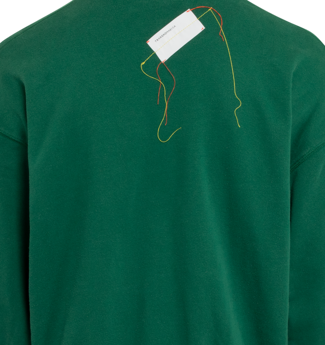 Image 4 of 4 - GREEN - This forest green upcycled vintage sweatshirt features "1910" applique at the front, Transnomadica label at the back.  80% cotton / 20% polyester. Measurements: 25 inches in length from neckline to front hem, 27 inches from shoulder-to-shoulder, 27 inches from armpit-to-armpit, 23 inches from top sleeve seam to top of wrist with size XXL on its original vintage label.This collection of vintage sweatshirts, exclusively for 1910 at Hirshleifers, each featuring a hand-crafted 1910 appl 