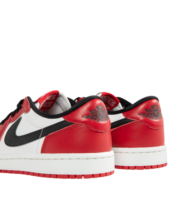 Image 3 of 5 - RED - JORDAN Air Jordan 1 Low OG Sneaker featuring genuine leather in the upper, Nike Air technology, lace up closure, rubber in the outsole for durable traction and wings logo on heel.