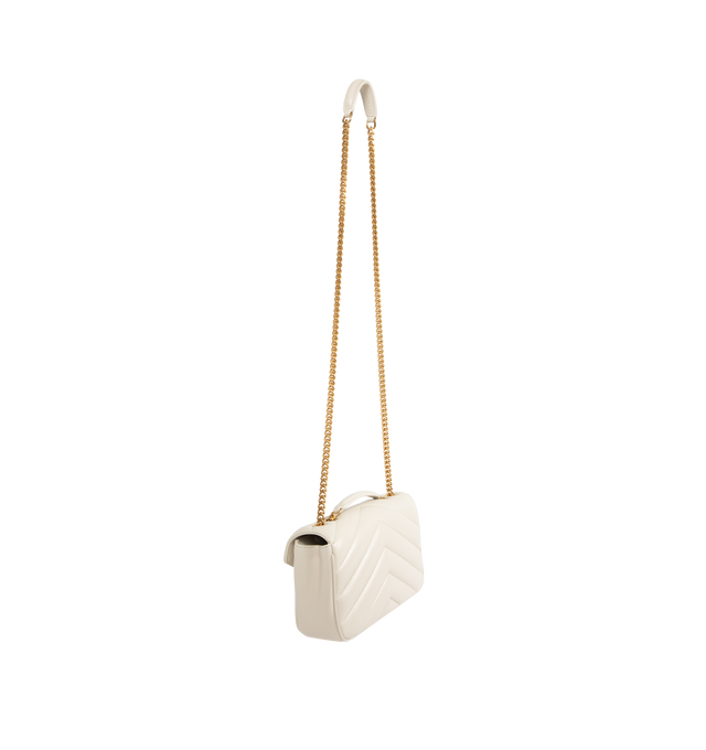 Image 3 of 4 - WHITE - SAINT LAURENT Loulou Small Bag featuring chain bag in soft lambskin with chevron-quilted topstitching, a removable leather pouch and pocket mirror, a sliding chain strap, grosgrain lining, bronze-toned hardware, magnetic snap closure and one flat pocket. 9.4" x 5.5" x 2.4". 90% lambskin, 10% brass. Made in Italy.