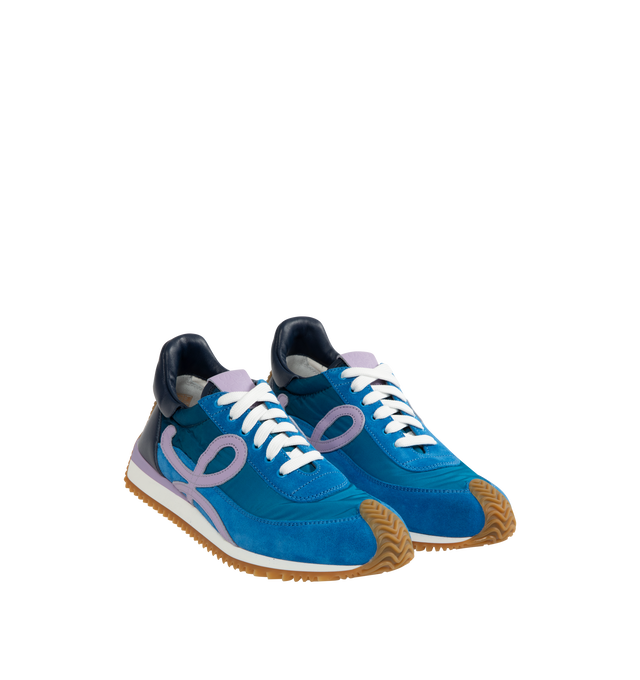 Image 2 of 5 - BLUE - LOEWE Flow Runner 2.0 featuring an updated ultra-flexible and lightweight construction, signature honey-coloured rubber outsole that extends from the toecap to the back of the heel, 25mm heel, signature L monogram on the side, embossed Anagram on the tongue and Gold embossed LOEWE on the heel tab. Runs a half-size larger. If between sizes, choose the smaller size. Nylon/Calf. Made in Italy.