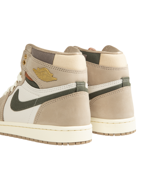 Image 3 of 5 - NEUTRAL - Women's Air Jordan 1 Retro High OG Sneakers feature a premium leather upper with suede overlays, a high-top silhouette, and signature Air Jordan Wings branding for a timeless heritage look. These lifestyle sneakers combine encapsulated Air-Sole cushioning, a perforated toe box, and a durable rubber outsole for lightweight comfort, breathable support, and reliable traction on and off the court. Main Material: Genuine Leather and Suede. Midsole: Encapsulated Air-Sole Unit. Sole: Rubbe