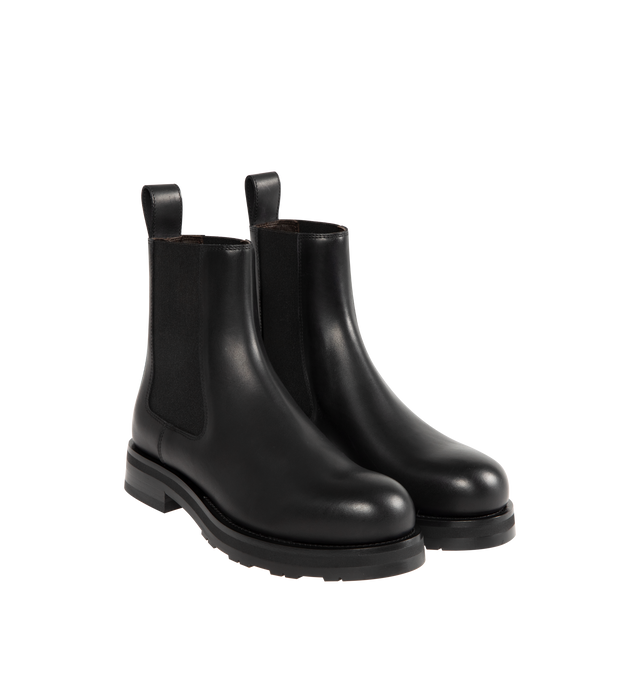 Image 2 of 4 - BLACK - THE ROW Chelsea Lug Sole Boots featuring round toe, pull-on style, branded leather insole, chunky rubber lug sole, ankle-length and elastic side panel. 100% calfskin leather. Sole: 100% rubber. Made in Italy.