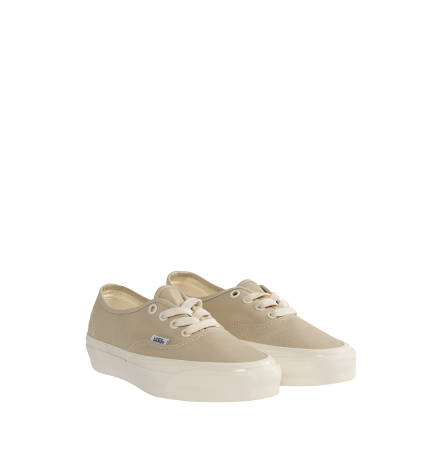 Image 2 of 5 - NEUTRAL - VANS Authentic Reissue 44 LX Sneakers featuring low-top, lightweight canvas upper,  lace-up closure, logo flag at outer side, rubber logo patch at heel, textured rubber midsole, treaded rubber sole and contrast stitching in white. Upper: canvas. Sole: rubber.  