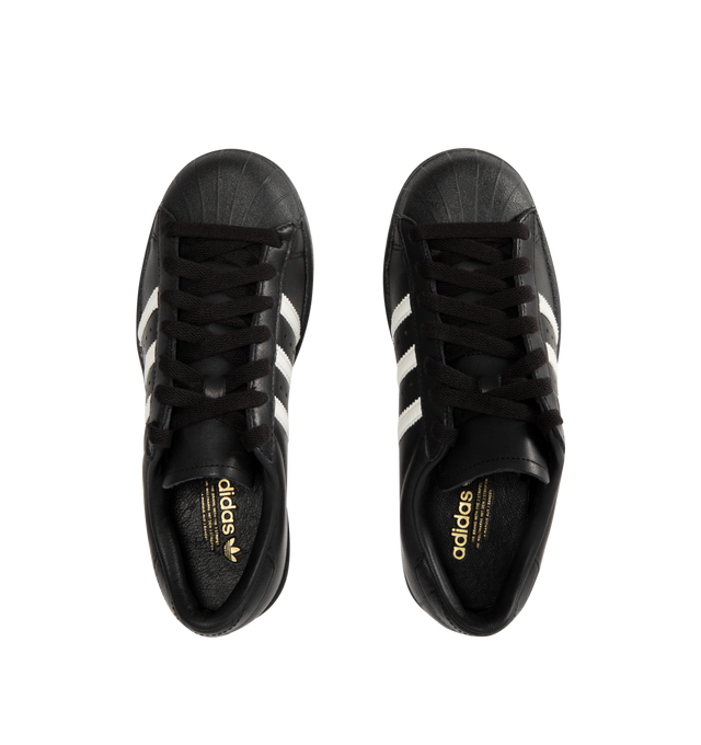 Image 5 of 5 - BLACK - ADIDAS Superstar Vintage Sneakers featuring a shell toe, 3-Stripes on side, heel tab, leather upper, lining and insole and rubber outsole.