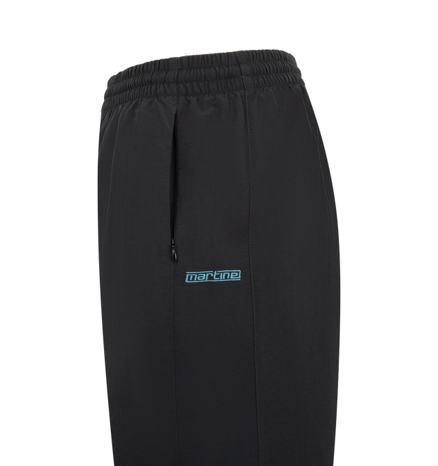 Image 3 of 3 - BLACK - MARTINE ROSE Paneled Nylon Track Pants featuring regular fit, elasticated drawstring waistband, two side zip pockets, contrasting side panels, embroidered logo and elasticated and zipped cuffs. 100% nylon.