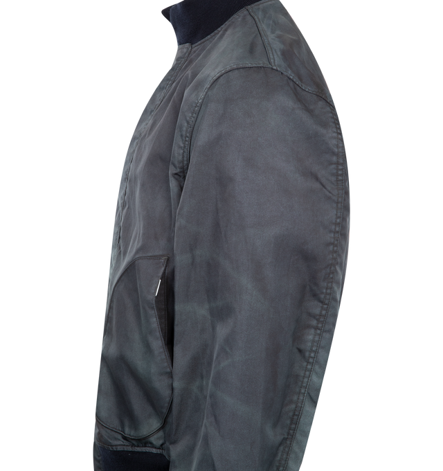 Image 3 of 3 - NAVY - JUNYA WATANABE US Navy Bomber featuring ribbed stand-up collar, long sleeves, ribbed cuffs and hem, hidden front closure with toggles, two side pockets, US Navy print on the back and straight hem. 100% nylon.