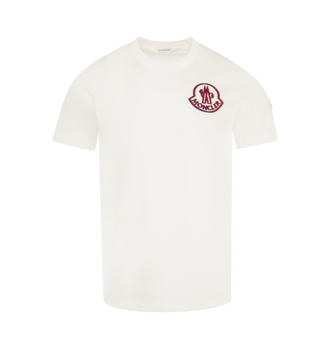 Image 1 of 3 - WHITE - MONCLER Logo Cotton T-Shirt featuring organic cotton jersey, crew neck, short sleeves and printed logo. 100% cotton. Made in Turkey.