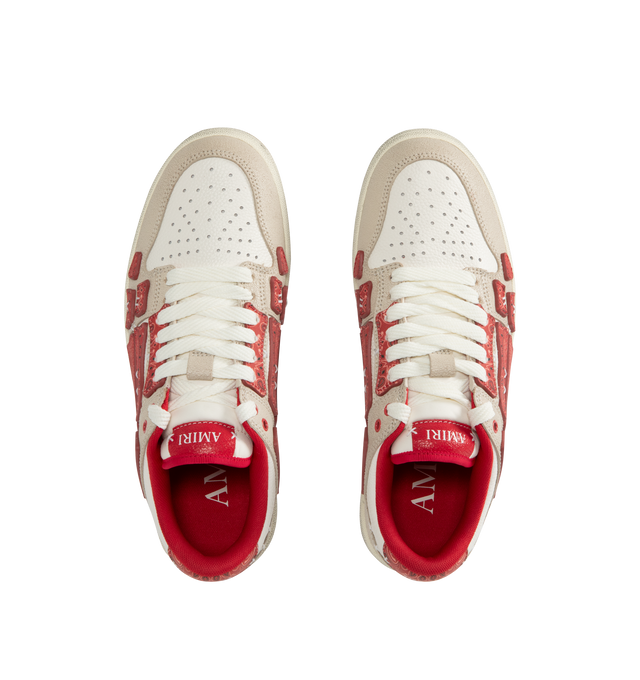 Image 5 of 5 - RED - AMIRI Bandana Skel Top Low Sneakers featuring low-top, buffed leather, logo pattern embossed throughout, perforated detailing at toe, lace-up closure, logo patch at padded tongue, padded collar, bandana print appliqus at sides and treaded rubber sole. Upper: leather. Sole: rubber.