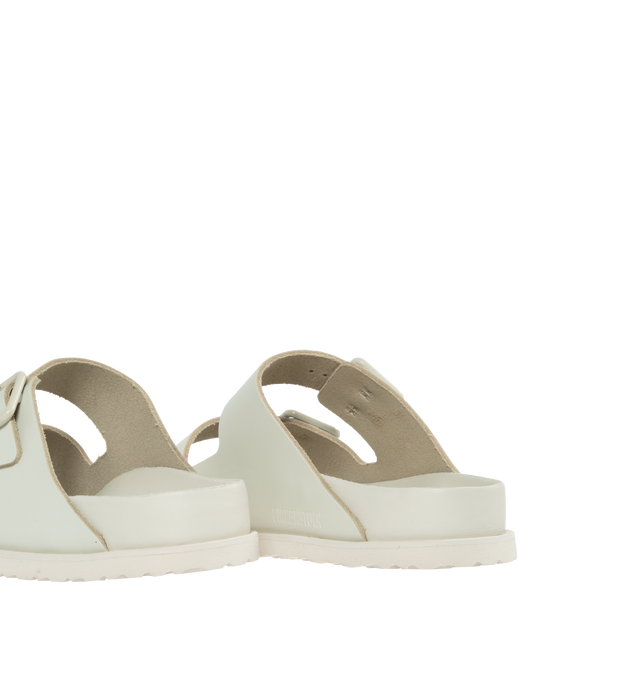Image 3 of 4 - WHITE - BIRKENSTOCK 1774 III ARIZONA featuring 1774 branding in the heel cup, premium semi-shiny smooth leather, anatomically shaped BIRKENSTOCK cork-latex footbed, covered with premium nappa leather and soft EVA outsole ensuring comfort and flexibility.  