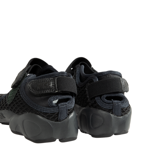 Image 3 of 5 - BLACK - Nike Women's Air Rift Sneaker featuring hook-and-loop straps on the midfoot and heel, Nike Air unit in the heel combined with plush foam, rubber detailing on the outsole, upper features a blend of elastane, polyester and nylon materials for a flexible fit and split toe design.