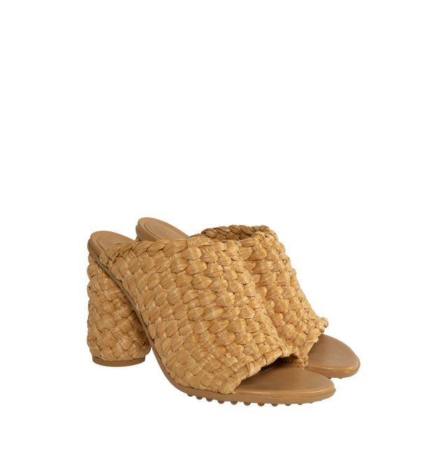 Image 2 of 4 - BROWN - BOTTEGA VENETA Atomic Intrecciato Raffia Sandals featuring woven raffia into a towering silhouette set atop a thick cylindrical heel, rubber-gripped soles and slips on. 4" heel. Raffia. Made in Italy. 