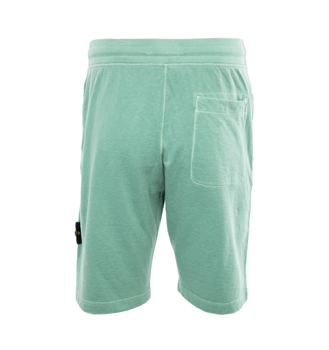 Image 2 of 4 - GREEN - STONE ISLAND Sweatshorts featuring regular fit, valet stand pockets with snap fastening, one patch pocket on back, Stone Island badge on the left leg and ribbed waistband with drawstring. 100% cotton. 