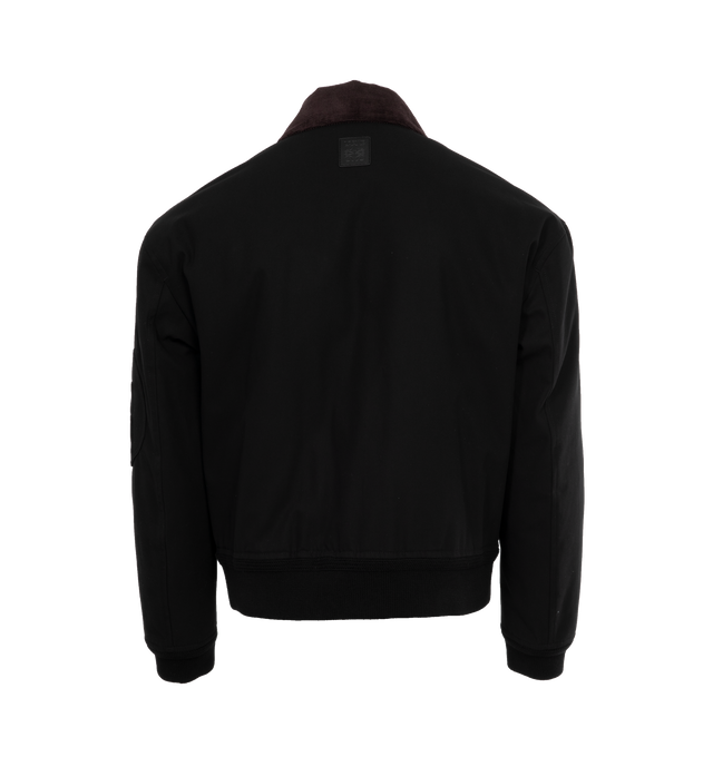 Image 2 of 4 - BLACK - LOEWE Bomber Jacket featuring contrast corduroy collar, rib knit cuffs and hem, zip front fastening, double patch pockets with buttoned flap, zipped utility pocket on the sleeve, inside welt pocket, quilted lining and LOEWE Anagram embossed leather patch placed at the back. 100% cotton. Made in Italy. 