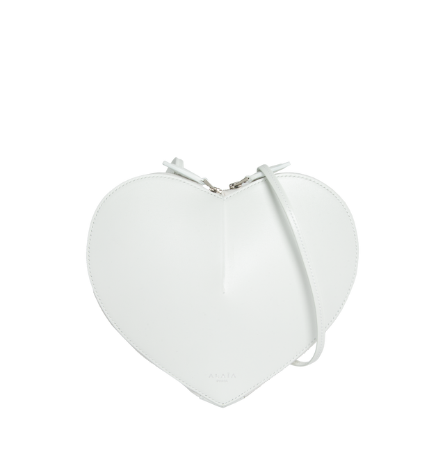 WHITE - ALAIA Le Coeur featuring heart shape, a simple cut in the leather creates volume and pure shape, zip closure and adjustable strap. L 21 X H 17 X D 5. 100% calfskin. Made in Italy. 