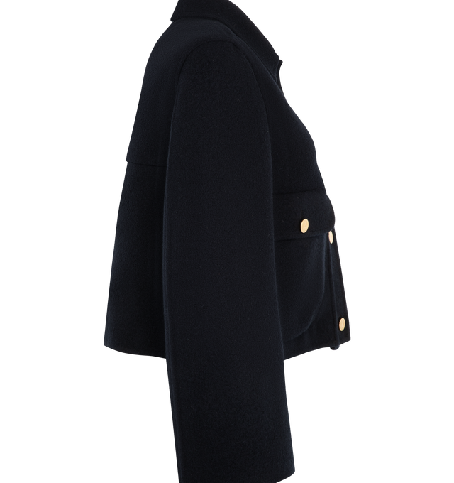 Image 3 of 3 - BLUE - Thom Browne Womens Bell Sleeve Boiled Wool Jacket is crafted from boiled virgin wool and features a sculptural silhouette with bell sleeves, front anchor-detailed button closure, bellows flap hand pockets, a tricolor-lined back yoke, and the signature striped grosgrain loop tab. This designer wool jacket combines architectural tailoring with a modern silhouette for elevated everyday layering. Main Material: 100% Virgin Wool; Lining: 100% Silk. Made in Italy.