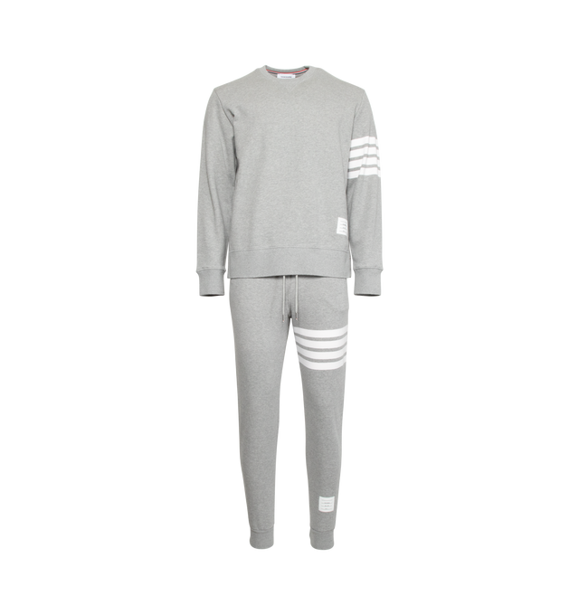 Image 5 of 5 - GREY - THOM BROWNE cotton jersey sweatpants with pull-on waist featuring drawcords, side pockets and slim leg with signature stripes, logo patch and cuffed hems.  