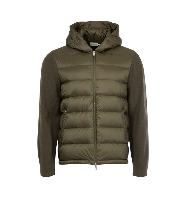 Image 1 of 3 - GREEN - MONCLER Padded Cardigan featuring longue saison lining, down-filled longue saison front, rib knit, gauge 12, mico soft hood, zipper closure, zipped pockets, quilted logo and logo patch. 100% polyamide/nylon. 100% virgin wool. Padding: 90% down, 10% feather.
