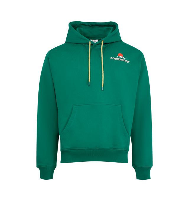 Image 1 of 2 - GREEN - CASABLANCA Montagne Hoodie featuring drawstring at hood, bonded logo graphic at chest, kangaroo pocket, rib-knit hem, side seams, and cuffs and dropped shoulders. 100% organic cotton. Made in Portugal.