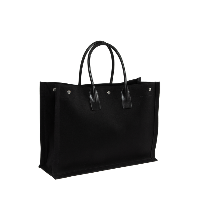 Image 2 of 3 - BLACK - SAINT LAURENT Rive Gauche Tote Bag featuring large leather handles, 3 magnetic snaps and one interior zipped pocket. 18.9 X 14.2 X 6.3 inches. 60% linen, 10% polyurethan, 30% calfskin leather. Made in Italy.  