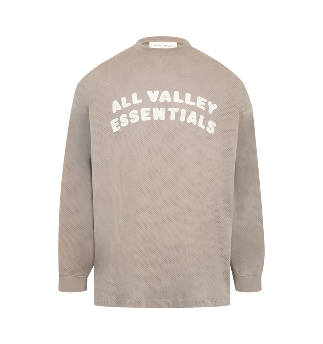 Image 1 of 2 - NEUTRAL - Fear of God Essentials Mens Sport Mesh Merch Long Sleeve Tee is crafted from cotton sport mesh. Features a boxy relaxed fit, ribbed crew neckline, dropped shoulders, ribbed cuffs, enzyme-washed finish, crackle-printed All Valley Essentials graphic at the front, crackle-printed "26" graphic at the back, and an Essentials signature label at the back collar. Main Material: 100% Cotton Sport Mesh.