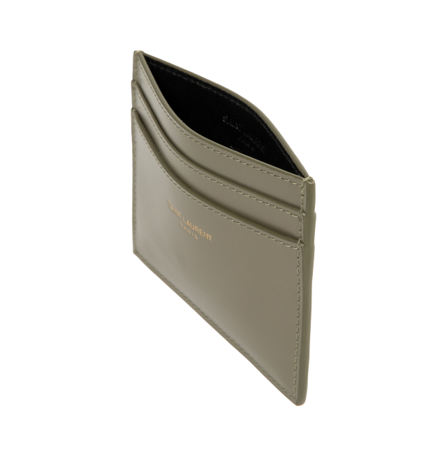 Image 3 of 3 - GREEN - SAINT LAURENT Card Case featuring Saint Laurent Paris signature, leather lining, bronze-tone hardware and five card slots. 4.1" x 3" x 0.2". Calfskin. Made in Italy.