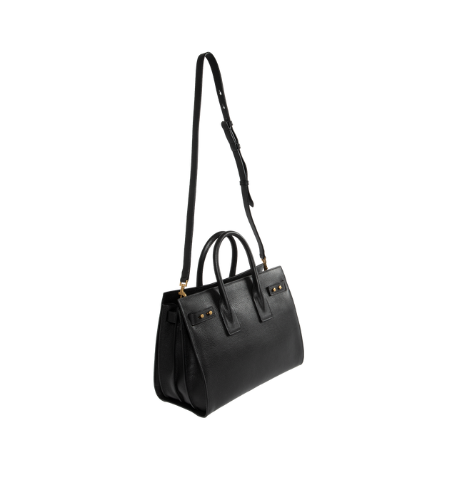 Image 2 of 3 - BLACK - SAINT LAURENT Sac De Jour Small in Supple Grained Leather featuring suede lining, accordion sides, detachable padlock in leather case, interior zipped pocket, five metal feet and detachable shoulder strap. 12.5 X 10 X 6.1 inches. 95% calfskin leather, 5% metal. Made in Italy.  