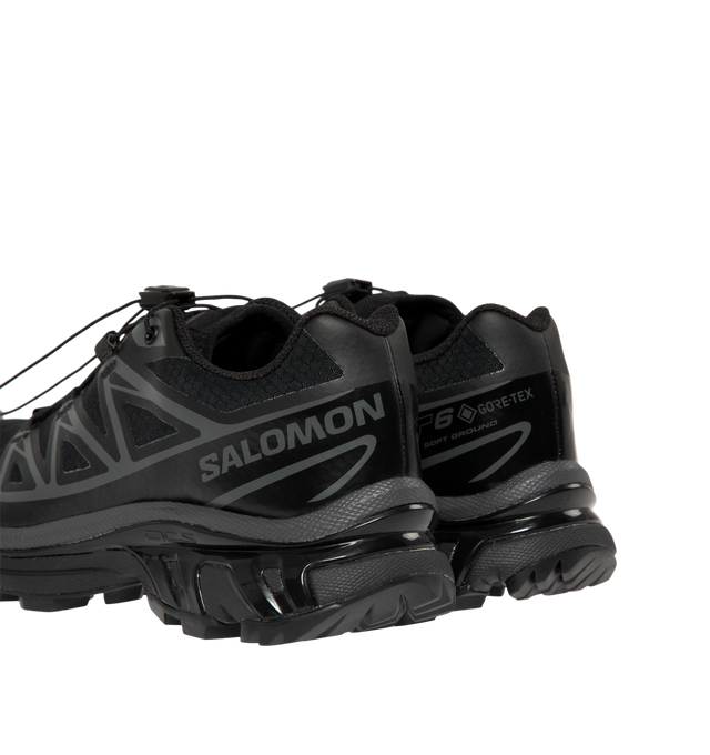 Image 3 of 5 - BLACK - Salomon Men's XT-6 GORE-TEX Sneakers are crafted with a lightweight textile upper and feature waterproof GORE-TEX protection, the brand's Agile Chassis System, and Quicklace technology for a secure, precise fit. Originally developed for ultra-distance trail running, these designer sneakers combine superior cushioning, stability, and all-terrain grip with Salomon's signature technical aesthetic, making them ideal for both outdoor performance and everyday wear. Main Material: Textile an