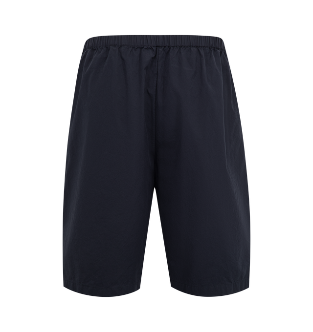 Image 2 of 3 - NAVY - THE ROW Zindel Short featuring relaxed pull-on short in washed Japanese cotton with gathered elastic waistband, side seam pockets, and above-the-knee length. 100% cotton. Made in Italy.