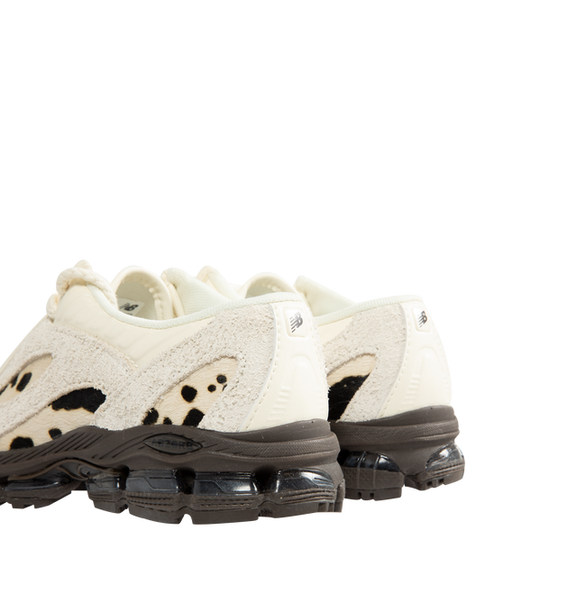 Image 3 of 5 - CREAM - New Balance 1890A Sneakers feature a progressive silhouette that combines everyday comfort with an elevated, formal-inspired design. Crafted with a premium leather apron upper, this versatile style is equipped with ABZORB midsole cushioning for superior impact absorption and ABZORB SBS heel cushioning for enhanced stability and comfort. Finished with an ultra-stable heel construction, the 1890A seamlessly blends performance heritage with refined styling. Main Material: Leather Upper.