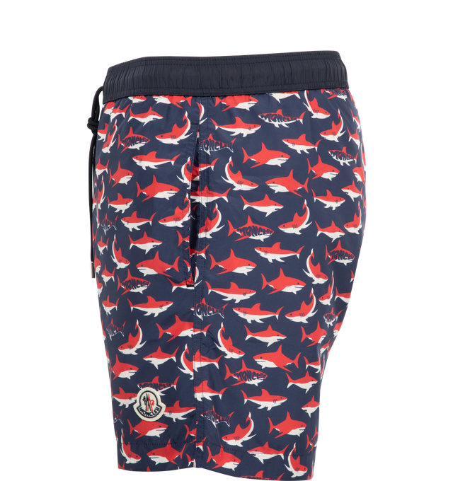 Image 3 of 3 - MULTI - MONCLER Shark Print Swim Trunks featuring elastic drawstring waist, side-seam pockets, back snap-flap patch pocket and mesh liner. 100% nylon.