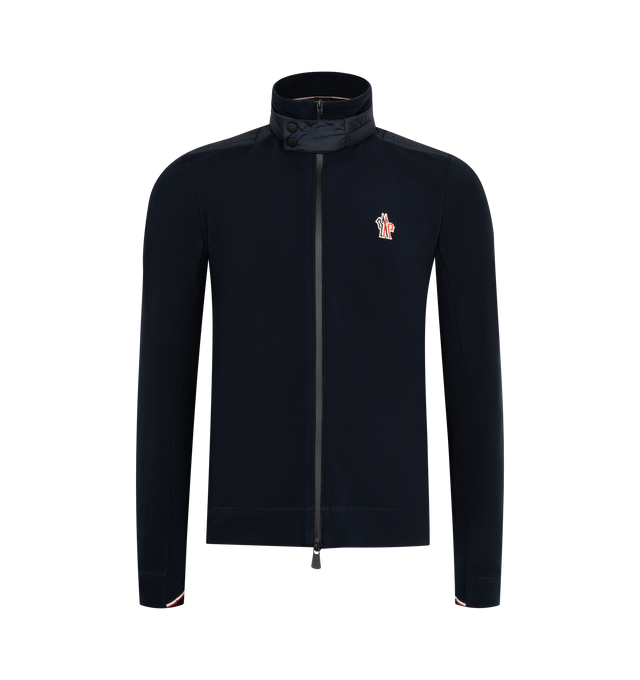 Image 1 of 3 - NAVY - MONCLER GRENOBLE Fleece Zip-Up Sweatshirt featuring stretch fleece, padded rainwear shoulder inserts and collar, nylon lining, double turtleneck, YKK AquaGuard water-repellent zipper and snap button closure, jersey wrist gaiters and tricolor detailing. 93% polyester, 7% elastane/spandex.