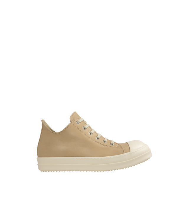 Image 1 of 5 - NEUTRAL - Rick Owens Low Sneaks Sneakers featuring low-top, vegetable-tanned spalla leather, LWG-certified leather, calfskin cap toe, lace-up closure, eyelets at inner side, buffed calfskin lining and treaded rubber sole. Upper: leather. Sole: rubber. Made in Italy.