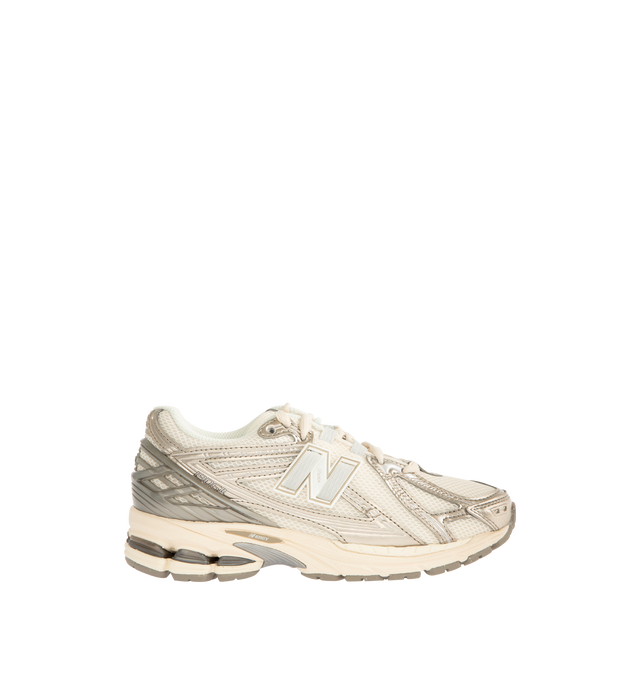 Image 1 of 5 - NEUTRAL - NEW BALANCE 1906R Sneaker featuring ACTEVA LITE midsole cushioning, ABZORB SBS heel cushioning, N-ergy outsole provides superior shock absorption, Stability Web outsole technology provides added arch support, TPU heel cage and rubber outsole. Mesh upper with synthetic overlays. Unisex style in men's sizes.
