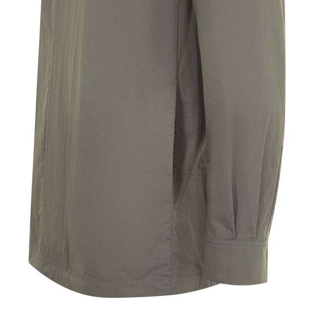 Image 3 of 3 - BROWN - THE ROW Thom Pantsenan Shirt featuring concealed button closure, button cuffs, classic collar, side slit pockets and straight hem. Made in Italy.