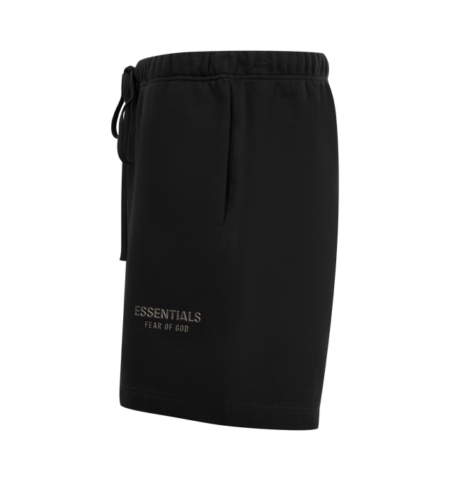 Image 3 of 3 - BLACK - FEAR OF GOD ESSENTIALS Soccer Fleece Shorts featuring cotton-blend fleece shorts, drawstring at elasticized waistband, two-pocket styling, rubber logo patch at front and bonded logo at leg. 80% cotton, 20% polyester.