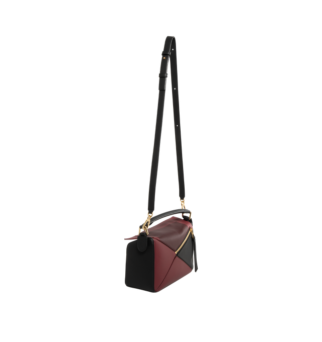 Image 2 of 3 - PURPLE - LOEWE Small Puzzle Bag in classic calfskin and suede featuring distinctive geometric lines and cuboid form. Shoulder, crossbody or hand carry, detachable and adjustable strap, zip closure with calfskin pull, one external zip rear pocket, one internal slip pocket, suede lining and embossed Anagram. Classic Calf/Suede. 16.5 cm x 24 cm x 10.5 cm. Made in Spain.