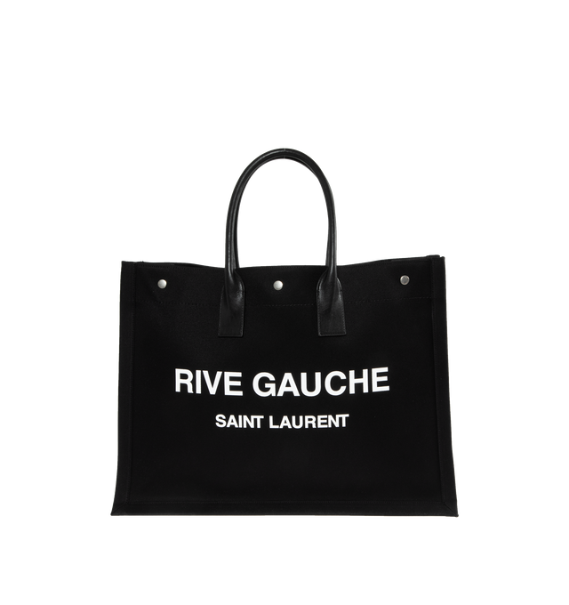 Image 1 of 3 - BLACK - SAINT LAURENT Rive Gauche Tote Bag featuring large leather handles, 3 magnetic snaps and one interior zipped pocket. 18.9 X 14.2 X 6.3 inches. 60% linen, 10% polyurethan, 30% calfskin leather. Made in Italy.  