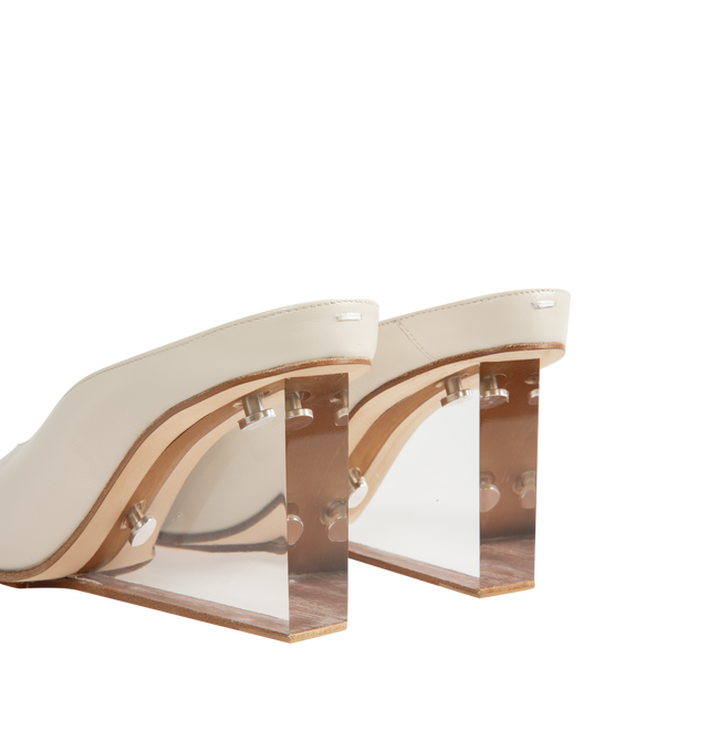 Image 3 of 4 - WHITE - Maison Margiela Women's Plexi Pump Mules are crafted from white calf leather with a soft, polished finish. The slip-on silhouette features a rounded toe, open back, sculpted transparent wedge heel, and the Maison's signature single white stitch at the back. Upper: 100% Calf Leather. Lining: 100% Ovine Leather. Contrast: 100% Calf Leather. Sole: 100% Calf Leather. Made in Italy.