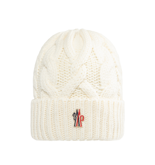 Image 1 of 2 - WHITE - MONCLER GRENOBLE Wool Beanie featuring ultra-fine wool, cable knit, gauge 3 and logo patch. 100% virgin wool. Made in Italy.