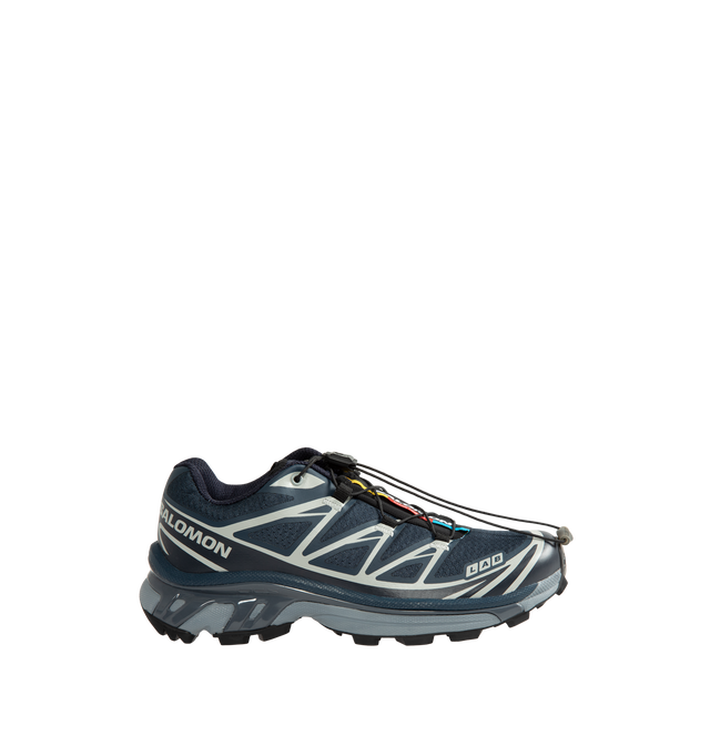 Image 1 of 5 - BLUE - Salomon Unisex XT-6 Steel Streets Sneakers are crafted from synthetic and textile materials and feature the iconic XT-6 silhouette reimagined with reflective metallic yarn and 3D mesh construction. Inspired by the raw energy of the city, this modern update enhances the model's signature SensiFit technology with a metallic finish, delivering a bold, high-shine look while maintaining the performance features that made the XT-6 a trail-running staple. Main Material: Synthetic and Textile