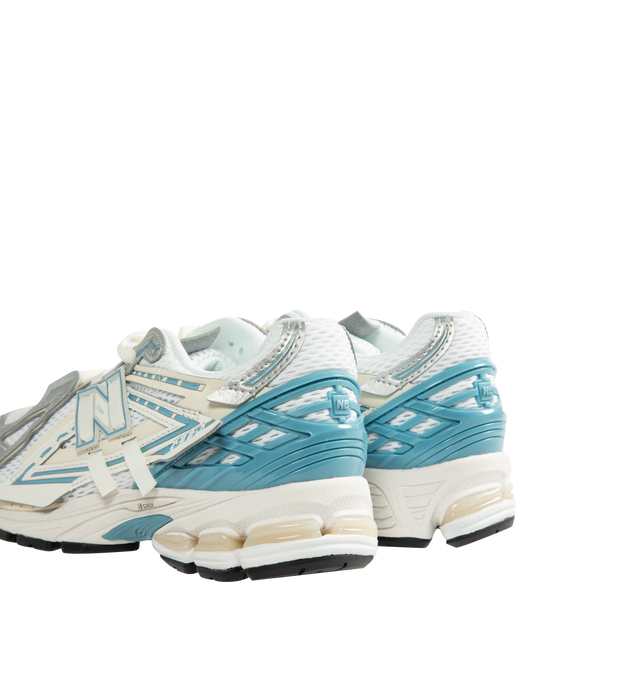 Image 3 of 5 - WHITE - New Balance 1906A Shoes feature a performance-inspired silhouette rooted in the brand's running heritage and equipped with advanced cushioning technologies for all-day comfort. Constructed with a breathable mesh upper, mesh underlays, and curvilinear synthetic overlays, this modern design offers a refined interpretation of early-2000s technical footwear. The sole unit combines ACTEVA LITE cushioning, ABZORB SBS heel pods, and an N-ergy outsole for responsive comfort and superior shock