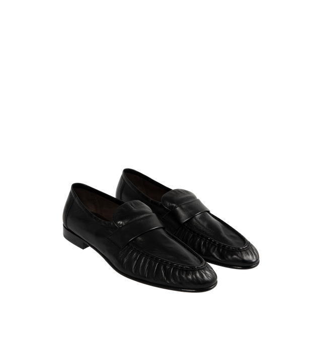 Image 2 of 4 - BLACK - THE ROW Soft Loafers featuring polished eel leather loafers, topstitching and gathering at moc toe, strap at vamp, logo stamp at footbed, suede lining, stacked leather block heel and hand-painted leather sole with rubber injections. Heel: H1". Leather. Made in Italy.