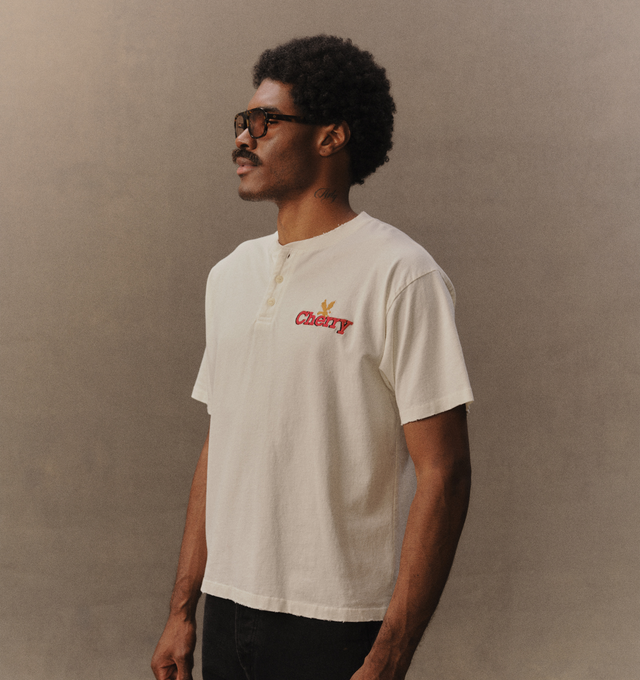 Image 5 of 6 - WHITE - Cherry LA Men's Henley T-Shirt is crafted from cotton and features a boxy-fit silhouette with a classic Henley neckline. Designed with embroidered detailing at the front, this elevated everyday essential combines relaxed proportions with signature Cherry LA styling. Main Material: Cotton. Made in Los Angeles, California.