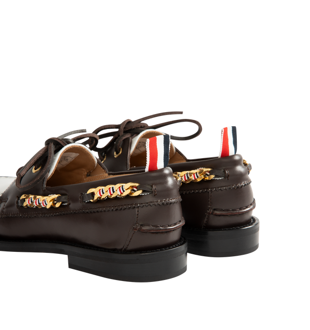 Image 3 of 4 - BROWN - THOM BROWNE Brogue Leather Boat Shoes featuring two-tone leather with a refined brogue-style perforated panel, classic silhouette, a chain-link trim interwoven with the houses signature stripes, almond toe, slips on, leather upper, leather lining and rubber sole. Made in Italy.